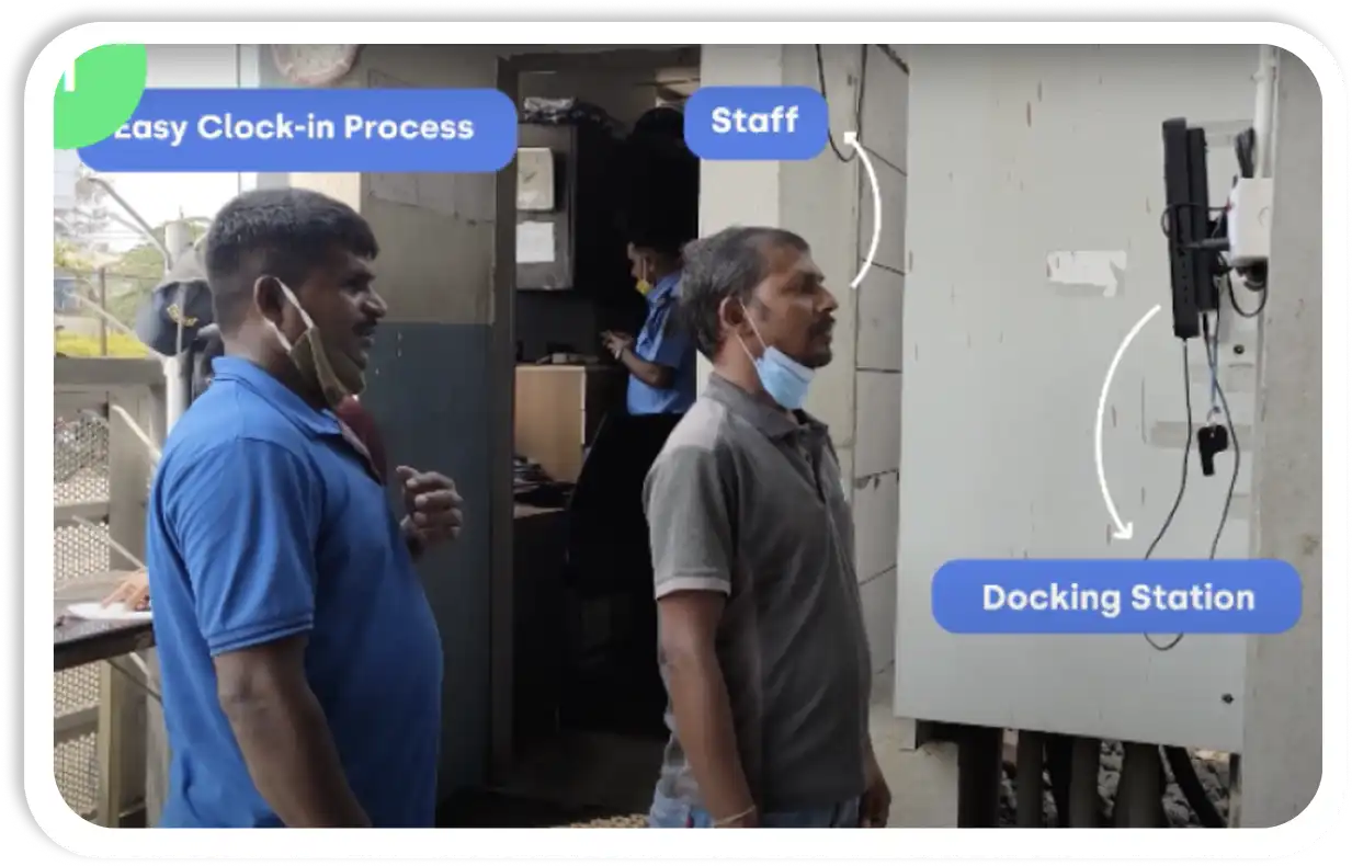 Two workers clocking in via Smartstaff's docking station